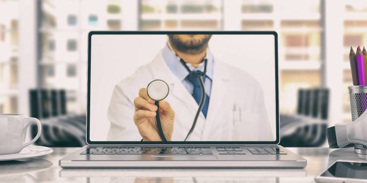 desktop with medical professional as wallpaper.jpg